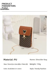 Detail of vintage PU leather phone bag with Mickey metal clasp and gold chain strap