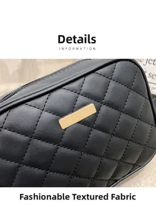 Close-up of black quilted PU leather bag with diamond stitching and gold metal plate