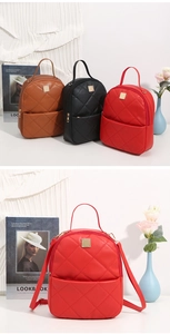 Detailed close-up of quilted PU leather mini backpack with gold hardware in red and brown