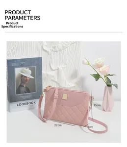 Pink quilted crossbody bag detail showing 22cm width dimensions and golden hardware