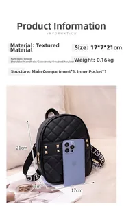 Detail view of black quilted mini backpack showing dimensions 17x7x21cm and golden rivets