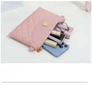 Pink quilted shoulder bag capacity view with phone, glasses and lipsticks
