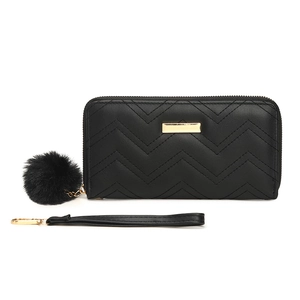 Women's black quilted long wallet with golden hardware and fluffy faux fur pompom charm