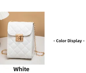 Close-up of white quilted chain bag with gold square rotary lock and stitch detail
