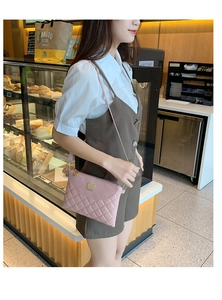 Quilted diamond pattern crossbody bag detail in pink PU leather with gold accents