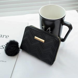 Black short wavy quilted wallet with gold plate and fluffy pompom charm for women