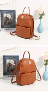 Detailed view of brown quilted backpack with elegant square gold hardware and diamond pattern