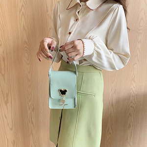 Chic mint green mini crossbody bag with cartoon mouse metallic clasp and star charm
