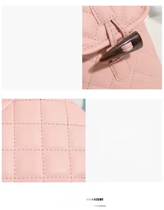 Detail of pink quilted crossbody bag featuring a classic horn buckle closure and stitching