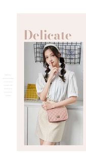 Close-up of pink quilted crossbody bag with gold hardware worn by a model in a minimal setting