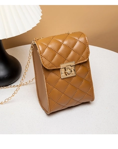 Detail shot of brown quilted crossbody bag with gold chain strap and metal turn-lock