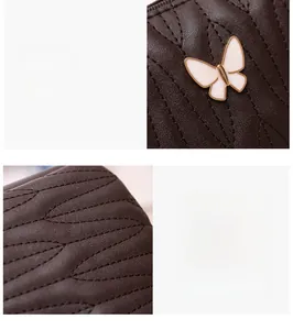 Detail of rhombic quilted brown shoulder bag with white butterfly metal hardware
