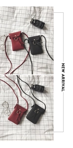 Detail of mini crossbody phone bag showing lychee texture PU leather and gold metal ring