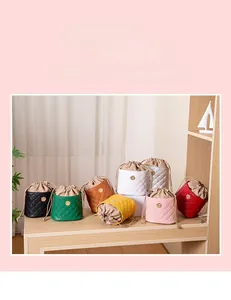 Quilted mini bucket bag display in 8 colors including black, green and brown leather