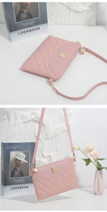 Detail of pink quilted crossbody bag featuring gold hardware and a metal logo plate