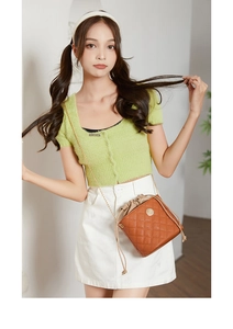 Brown quilted leather bucket bag with drawstring closure and golden chain strap detail