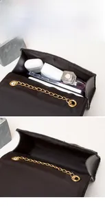 Internal view of the quilted chain bag showing large capacity for essentials