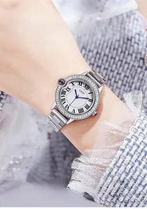 Detail of silver luxury women's watch with Roman numerals and diamond-set bezel