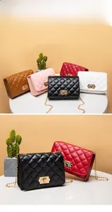 Detailed view of luxury quilted chain bags in multiple colors with gold square clasps