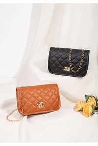 Quilted chain bags in black and brown with golden C-lock and embroidery texture