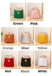 Close-up of multicolored quilted leather bucket bags featuring metal chain straps and drawstring