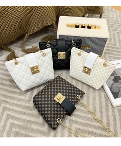 Detailed arrangement of quilted chain bucket bags in multiple colors and vintage patterns