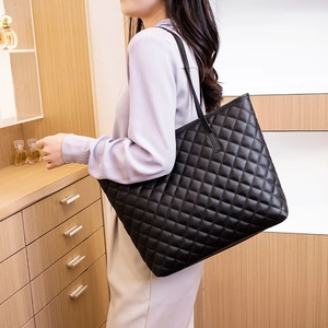 Chic black quilted faux leather tote bag with large capacity for women's daily commute