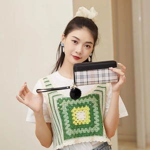 Women's tri-color plaid wallet clutch with wristlet strap and black fur pom-pom charm