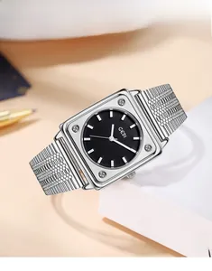 Macro side view of silver mesh band women's square watch with black dial and studs
