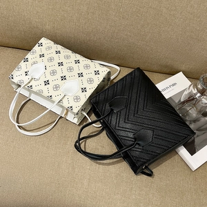 Minimalist square tote bags in white floral print and black quilted PU leather