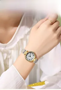 Detailed view of the vintage Roman style steel watch strap with five-bead gold design