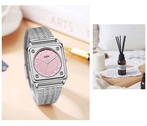 Detail of square pink dial watch with silver mesh strap and decorative crystals