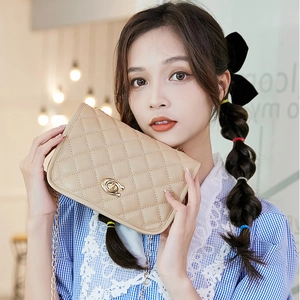 Chic beige quilted crossbody bag for women with gold chain strap and metal turn-lock