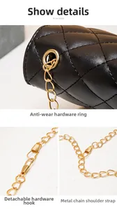 Detail view of black quilted leather bag with gold metal chain and reinforced eyelets