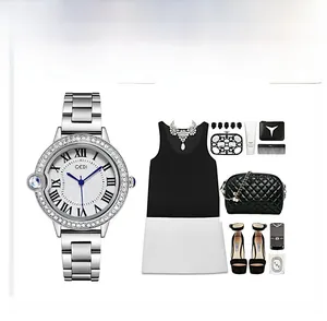 Detail of silver quartz watch with roman numerals, blue hands and rhinestone bezel