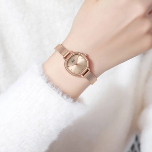 Elegant rose gold women's quartz watch with minimalist rectangular dial and mesh band