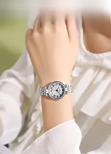 Close-up of GEDI vintage silver watch with Roman numerals and wave pattern dial