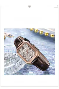 Detail of rectangular rose gold watch with crystal dial and brown leather strap