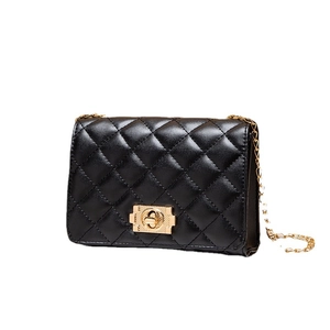 Classic black quilted crossbody chain bag with gold hardware on a clean white background