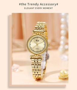 Detailed macro view of a luxury gold ladies quartz watch with a metallic link bracelet
