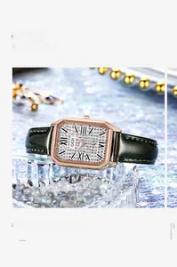 Detailed view of luxury rectangular rose gold watch with crystal dial on black leather strap