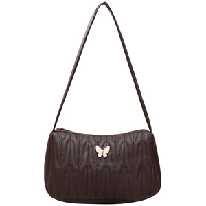 Dark brown quilted shoulder bag with wave pattern and white butterfly metal accent
