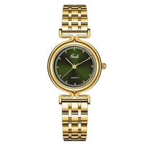 Elegant gold metal band quartz watch for women with a minimalist green round dial