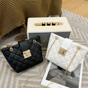 Chic quilted chain bucket bag with square lock in black and white classic colors