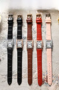 Detail view of rectangular vintage quartz watches with colorful embossed leather straps
