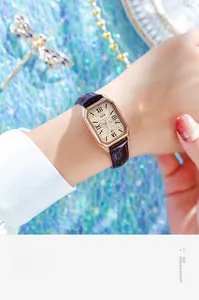 Elegant rose gold rectangular watch with rhinestone dial and purple leather strap
