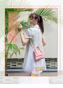 Detail of pink mini handbag with golden chain strap and leather handle for women