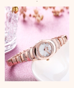 Macro view of rose gold bracelet watch with mother of pearl dial and sparkling crystals