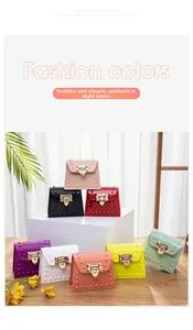 Detailed close-up of mini PVC jelly bags with gold metal clasps in eight vibrant colors
