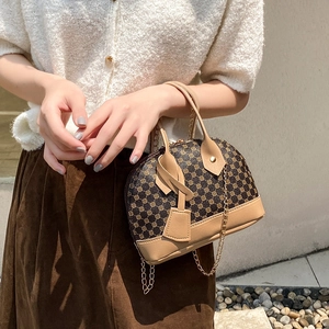 Vintage shell-shaped printed handbag with dark brown pattern and chain strap